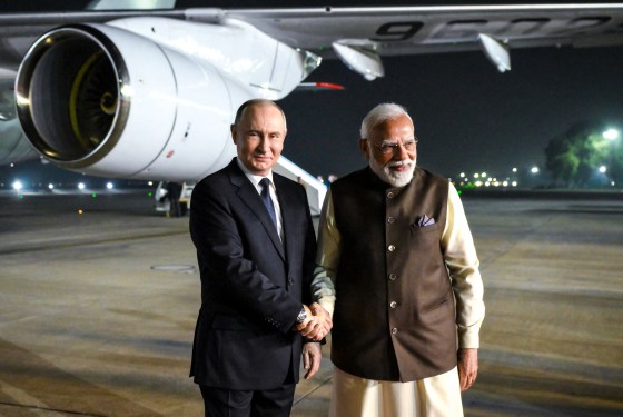 Image: IRussia's President Vladimir Putin is welcomed by Indian Prime Minister Narendra Modi