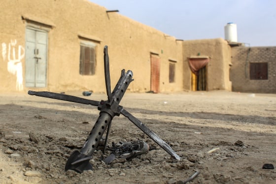 A mortar lies on the ground near a damaged house in Chaman on Dec. 6 following overnight cross-border fire between Pakistan and Afghanistan.