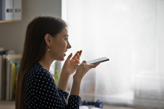 Woman speaking into phone