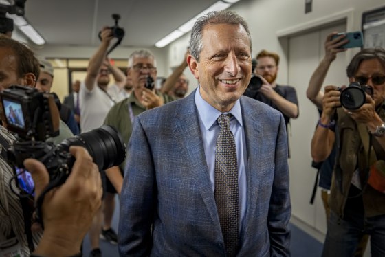 New York City Comptroller Brad Lander walks into immigration court