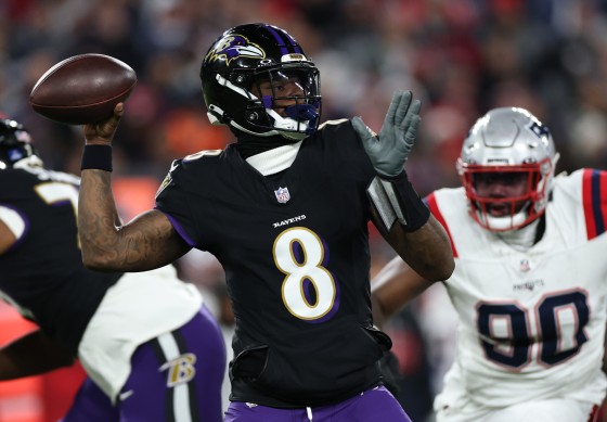 Lamar Jackson of the Baltimore Ravens passes against the New England Patriots. 