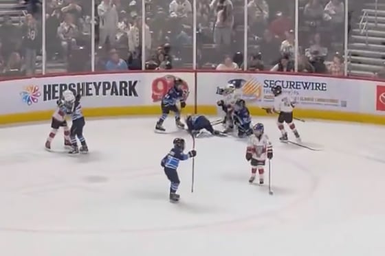 A screengrab from a video of the Mites hockey players engaging in brawl during Hershey Bears AHL game intermission.