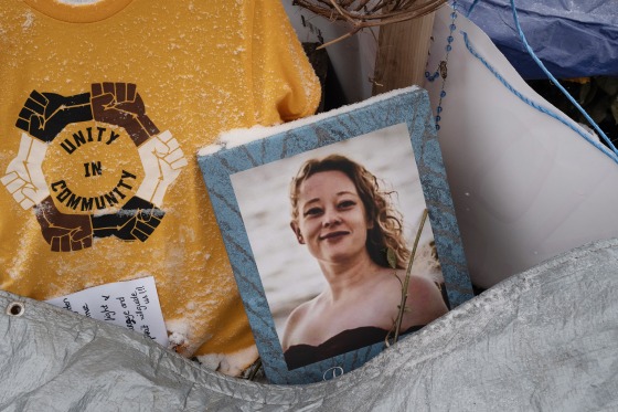 A picture of Renee Good sits alongside other items which make up a memorial at the site where she was killed on January 18, 2026 in Minneapolis, Minn.