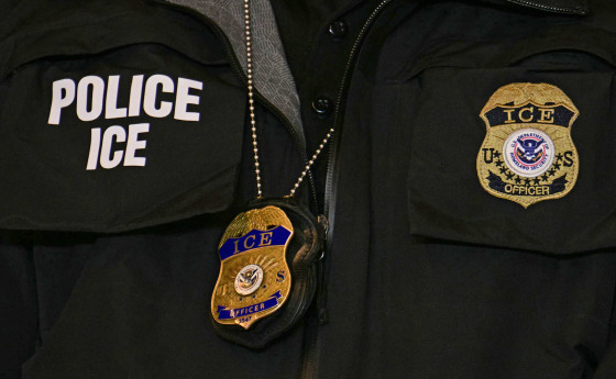 An ICE patch and badge on an officer in Minneapolis.