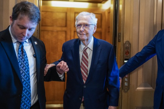 Sen. Mitch McConnell standing outside an elevator