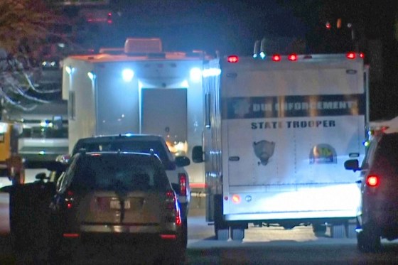 Emergency cervices work at a scene of a DPS helicopter crash in Flagstaff, Ariz.