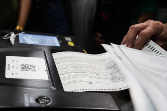 Voters fill out their ballots at a polling place on Election Day in San Juan, Puerto Rico.