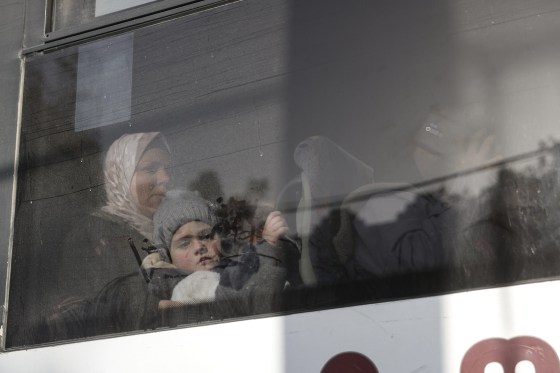 War-wounded Palestinians and other patients sit in a coach as they prepare to leave the Gaza Strip for treatment through the Rafah border crossing between the Gaza Strip and Egypt on February 8.