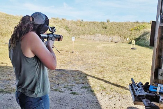 A woman takes aim at the "Grassroots Defense" firing range in Iowa.