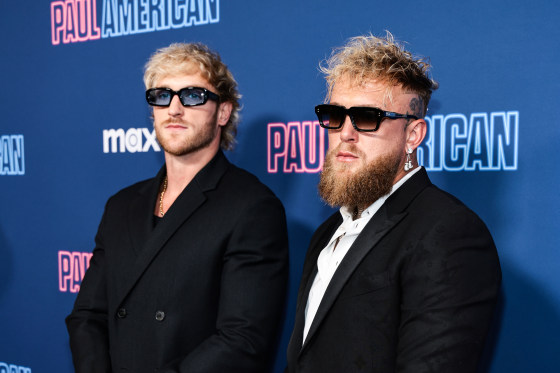Logan Paul, left, and Jake Paul stand for portraits on the red carpet