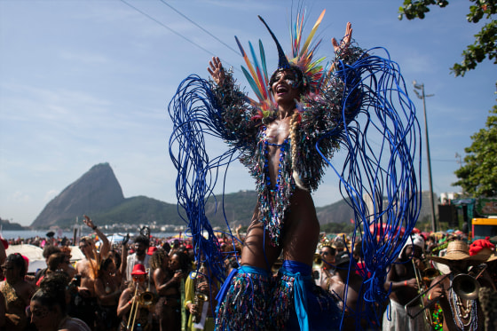 Raquel Poti performs on stilts during the Amigos da Onca Carnival street party, in Rio de Janeiro on Saturday.