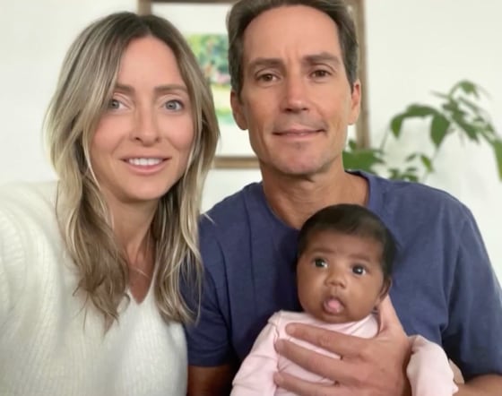 A group photo of Tiffany Score, Steven Mills, and their baby.