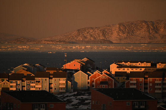 Houses of a residential area and ice floes floating on the sea are seen at the coastline of Nuuk, Greenland on January 29.