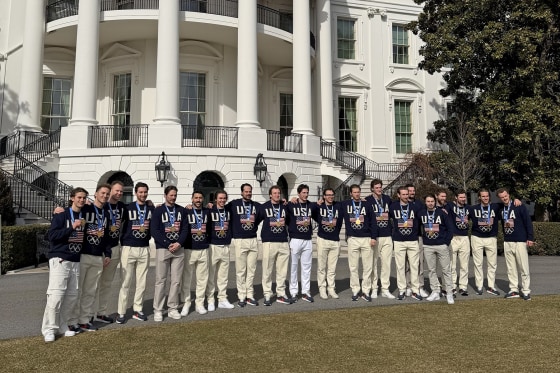 The U.S. men's hockey team poses with their gold medals at the White House on Feb. 24, 2026.