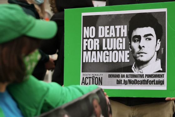 A black and white sign reads NO DEATH FOR LUIGI MANGIONE.