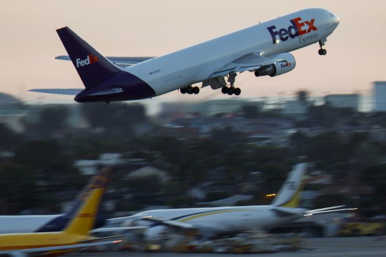 A FedEx Boeing 767 airplane departs from Los Angeles International Airport.