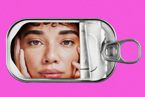 A woman's face inside an empty tin sardine can.