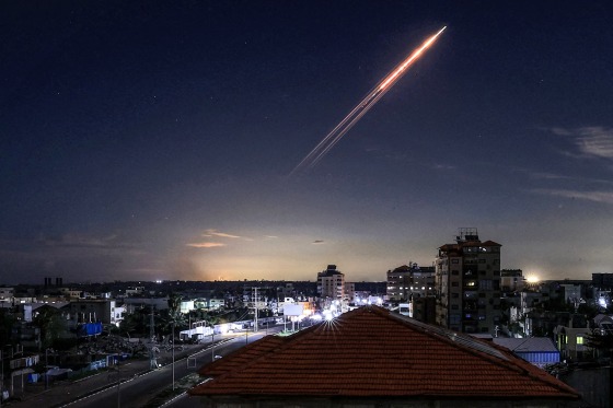 Image: A missile launched from Iran in the sky, viewed from the Bureij camp for Palestinian refugees in the central Gaza Strip