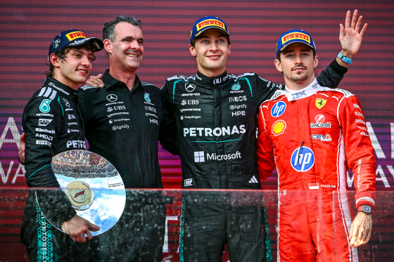Image: First-placed Mercedes' British driver George Russell celebrates on the podium