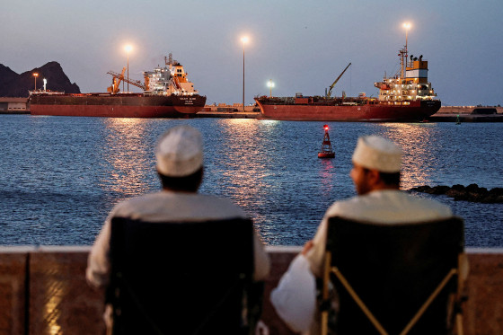 Galaxy Globe bulk carrier and Luojiashan tanker sit anchored in Muscat