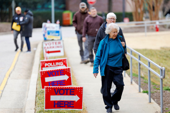 Voters walk into a polling station during the state’s primary election