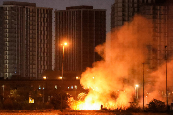 A fire burns outside the grounds of the US Embassy headquarters in Baghdad's fortified "Green Zone