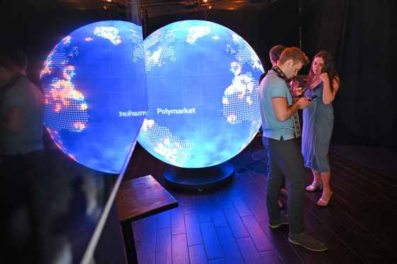 People gather during the opening of the Polymarket bar “The Situation Room” on March 20, 2026 in Washington, D.C.
