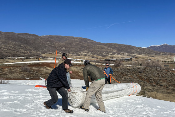 Soldier Hollow Nordic Center staa roll out Snow Secure as part of the snow preservation process.
