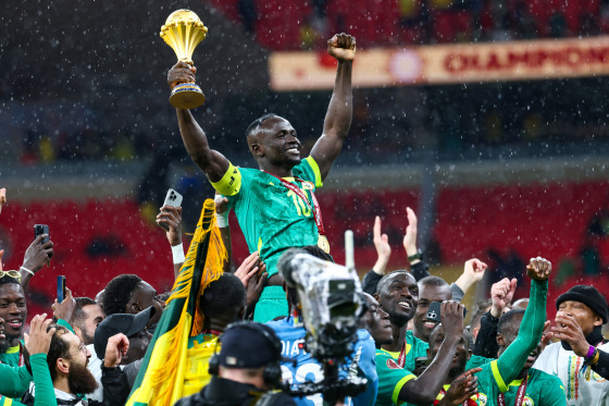 Senegal's forward Sadio Mane celebrates with the trophy after winning the Africa Cup of Nations (CAN) final football match against Morocco on Jan. 18, 2026. 