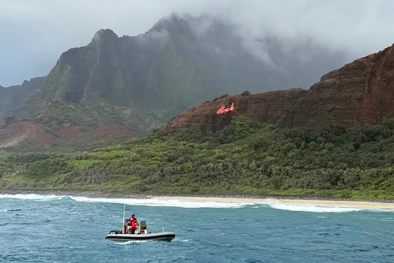 The Coast Guard, agency partners and volunteers respond to a helicopter crash off Kalalau Beach on Kaua'i, Hawaii on Thursday. 