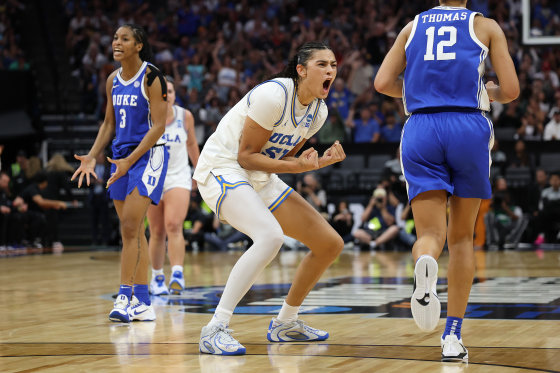 on-court action during an NCAA women's basketball game.