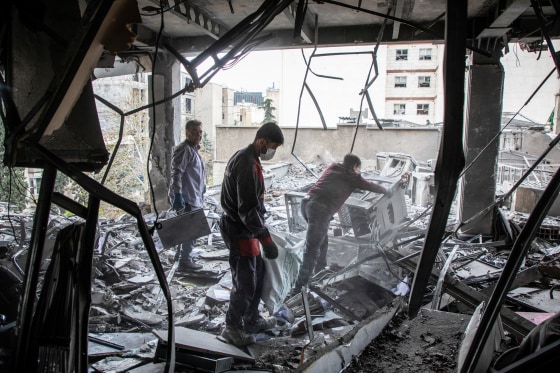 People activity to retrieve items from a building deed by a strike