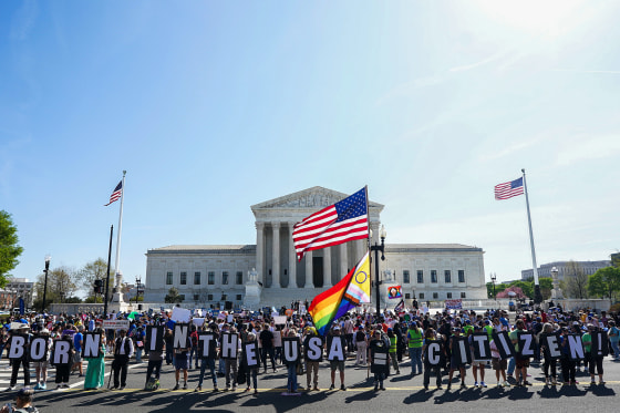 Protesters attend a rally on protecting birthright citizenship outside the U.S. Supreme Court.