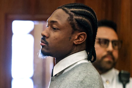 Stefon Diggs stands in a courtroom