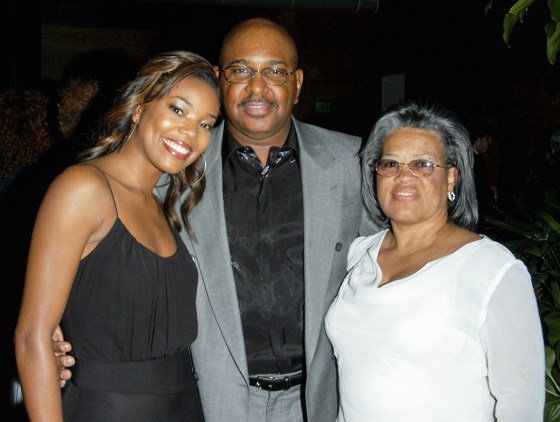 From left, Gabrielle Union, Sylvester Union, and Chris Union pose for a family portrait