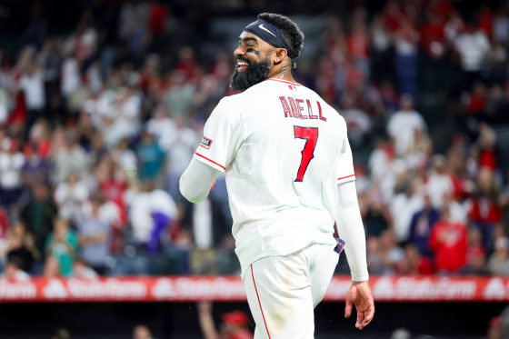 Jo Adell walks on the baseball field in uniform
