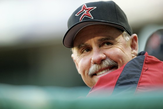 Phil Garner smiles while wearing a Houston Astros hat.