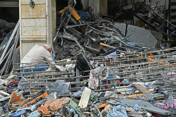 A resident inspects the rubble of a destroyed building upon his arrival back in the southern Lebanese city of Nabatieh on Saturday.