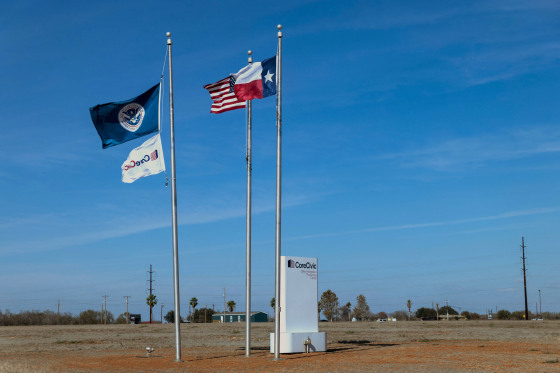 A Department of Homeland Security flag flies alongside the U.S. and Texas flags at the South Texas Family Residential Center