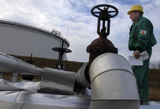 An engineer checks the receiving area of the Druzhba oil pipeline in Szazhalombata, Hungary, 