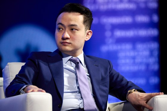 Justin Sun seated on a couch
