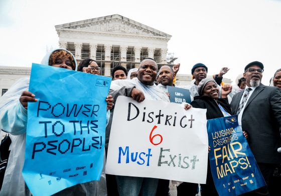 People rally outside the U.S. Supreme Court