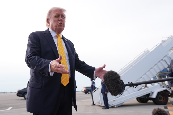 Image: President Donald Trump talks to reporters before he boards Air Force One.