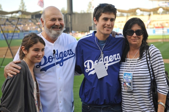 June 04, 2010 - Los Angeles, California, U.S - 04 June 2010: The Reiner family from left daughter Romy Reiner, Rob Reiner, Jake Reiner, and Michele Singer Reiner pose for a picture before the Dodgers game. The Los Angeles Dodgers defeated the Atlanta Bra