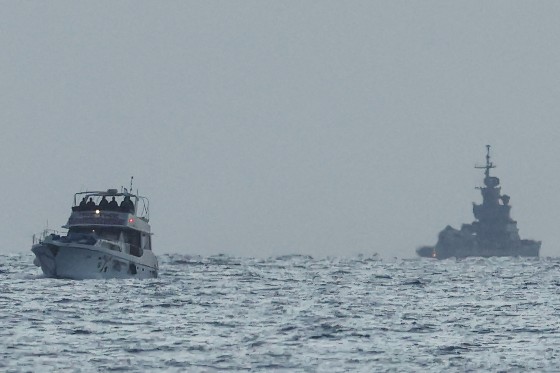A boat bearing symbols of one of the vessels belonging to the Gaza-bound aid flotilla (L) and intercepted by the Israeli navy in international waters.