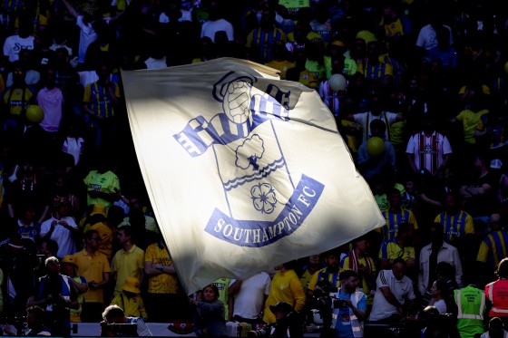 A flag is seen with the logo / badge of Southampton FC.