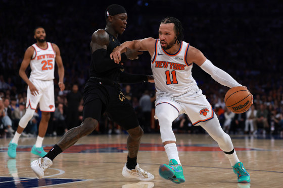 NEW YORK, NEW YORK - MAY 19: Jalen Brunson #11 of the New York Knicks drives around Dennis Schroder #8 of the Cleveland Cavaliers during the fourth quarter in Game One of the NBA Eastern Conference Finals at Madison Square Garden on May 19, 2026 in New York City.
