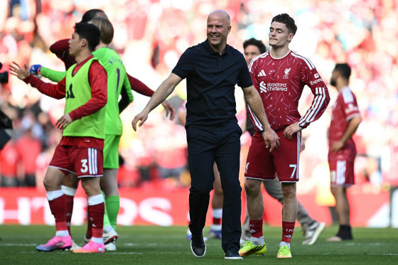 Liverpool's Dutch manager Arne Slot reacts on the pitch after the English Premier League football match between Liverpool and Brentford at Anfield in Liverpool.