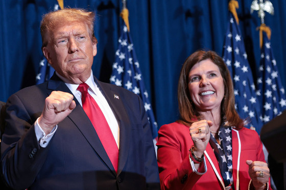 Donald Trump and Lt Governor Pamela Evette stand on stage during an election night watch party at the State Fairgrounds on February 24, 2024 in Columbia, South Carolina.