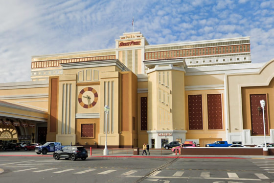 The exterior of South Point Casino, painted yellow walls and red accents